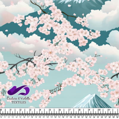 Cherry blossoms in full bloom against a backdrop of mountains