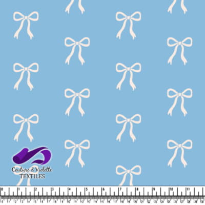 Blue fabric with white bow pattern design